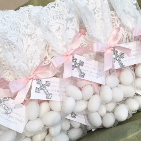 White lace bonbonniere bags with cross