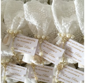 White lace bonbonniere bags with mini rosary beads