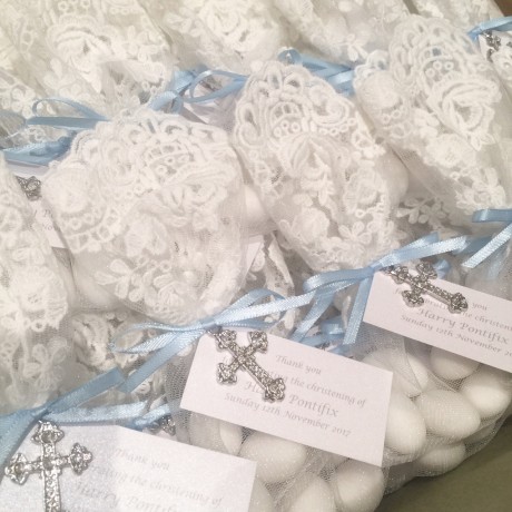 White lace bonbonniere bags with cross