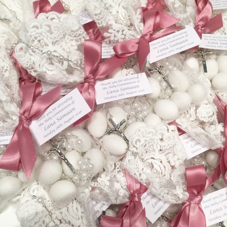 White lace bonbonniere bags with rosary bead