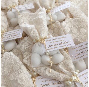 Ivory lace bonbonniere bags with mini rosary beads
