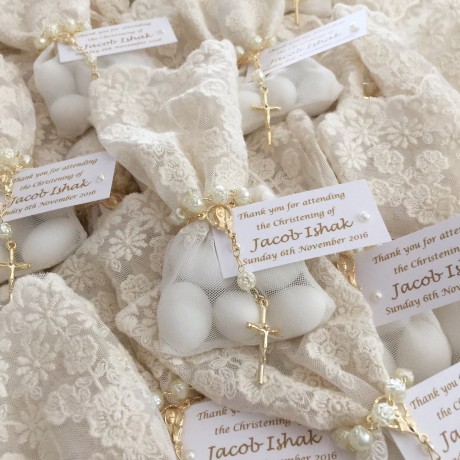 Ivory lace bonbonniere bags with mini rosary beads